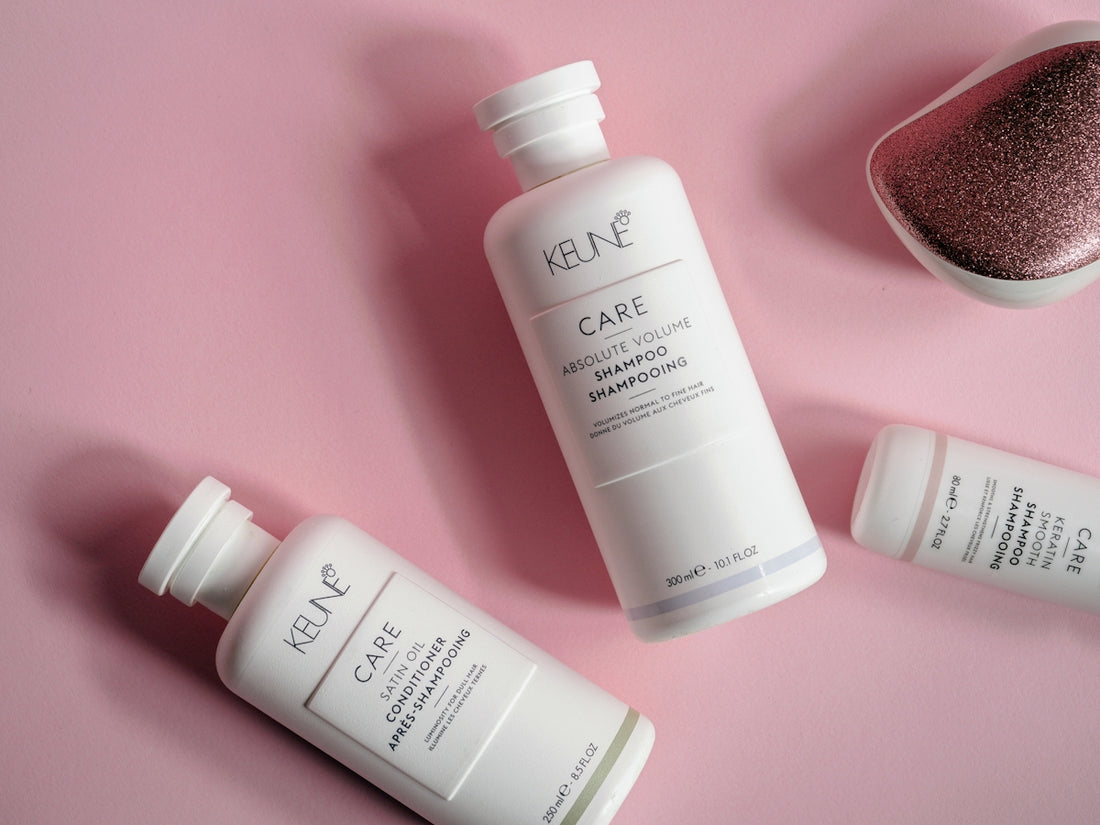 a bottle of keune care next to a container of hair care